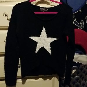 Soft black sweater with a white star